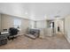 Living space featuring desk area, small couch, and loft space at 26909 E Cedar Ave, Aurora, CO 80018