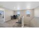 Loft space with desk, chair, and gray sofa overlooking the neighborhood at 26909 E Cedar Ave, Aurora, CO 80018