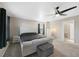 Spacious main bedroom with a ceiling fan, a plush bed, and views, creating a comfortable and tranquil retreat at 26909 E Cedar Ave, Aurora, CO 80018