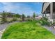 Lush backyard with healthy green lawn and manicured landscaping, ideal for outdoor activities and relaxation at 2932 Eagle Wing Way, Castle Rock, CO 80109