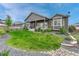 Picture of the home's backyard with a covered patio and rock landscaping at 2932 Eagle Wing Way, Castle Rock, CO 80109