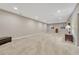 Spacious basement with plush carpet, neutral walls, recessed lighting, and bright windows for a versatile living space at 2932 Eagle Wing Way, Castle Rock, CO 80109