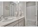 Bathroom features a dual sink vanity with white countertops and tile floors at 2932 Eagle Wing Way, Castle Rock, CO 80109