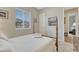 Cozy bedroom features a four-poster bed, soft carpet, neutral walls, and a window with neighborhood views at 2932 Eagle Wing Way, Castle Rock, CO 80109