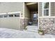 Charming home exterior featuring a covered porch, stone accents, and a well-maintained front yard at 2932 Eagle Wing Way, Castle Rock, CO 80109