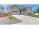 Attractive home exterior with a three car garage, well-kept landscaping, and inviting curb appeal at 2932 Eagle Wing Way, Castle Rock, CO 80109