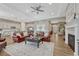 Spacious living room with hardwood floors that connects to the kitchen and dining area at 2932 Eagle Wing Way, Castle Rock, CO 80109