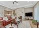 Cozy living room featuring a fireplace, hardwood floors, and ample seating for relaxation at 2932 Eagle Wing Way, Castle Rock, CO 80109