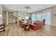 Cozy living room with a fireplace, hardwood floors, two couches and large windows with coverings at 2932 Eagle Wing Way, Castle Rock, CO 80109