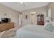 Cozy bedroom features neutral walls, ceiling fan, dresser, and a comfortable bed at 2932 Eagle Wing Way, Castle Rock, CO 80109