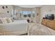 Bright bedroom with bay window, neutral walls, plush carpet and a cozy reading nook at 2932 Eagle Wing Way, Castle Rock, CO 80109