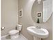 Well-lit powder room with a pedestal sink, and a toilet at 2932 Eagle Wing Way, Castle Rock, CO 80109