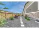Serene side yard featuring stone pathway and lush garden, blending elegance and natural beauty with the home at 2932 Eagle Wing Way, Castle Rock, CO 80109