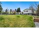 Expansive backyard showcasing lush greenery and a well-maintained lawn, offering ample space for recreation and outdoor activities at 6439 E Maplewood Ave, Centennial, CO 80111