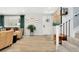 Bright entryway featuring hardwood floors, staircase, and decorative accents at 6439 E Maplewood Ave, Centennial, CO 80111