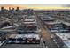 Picturesque Denver city skyline at sunset; aerial view featuring neighborhood streets and charming homes at 1235 31St St, Denver, CO 80205