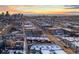 Stunning aerial view showcases the city skyline and vibrant neighborhood at sunset at 1235 31St St, Denver, CO 80205