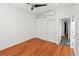 This bright bedroom features hardwood floors, a ceiling fan, and built-in closet for optimal storage at 1235 31St St, Denver, CO 80205