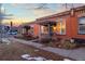 Brick row house with a charming covered porch, showcasing classic architectural details at 1235 31St St, Denver, CO 80205