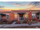 Charming brick home with a cozy front porch and inviting curb appeal at sunset at 1235 31St St, Denver, CO 80205