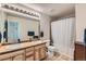 Shared bathroom with double sinks and tub shower at 12704 Jasmine St # E, Thornton, CO 80602