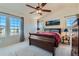 Spacious main bedroom boasts large windows and high ceiling at 12704 Jasmine St # E, Thornton, CO 80602