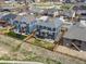 An aerial view of a two story homes with fenced yard and an outdoor patio with green space nearby at 8346 E 132Nd Dr, Thornton, CO 80602