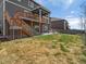Expansive backyard with a patio, stairs to backyard, and a firepit at 8346 E 132Nd Dr, Thornton, CO 80602