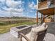 Enjoy the backyard with a fire pit, patio, and green space at 8346 E 132Nd Dr, Thornton, CO 80602
