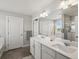 Bathroom with double sink vanity, large mirror, and glass shower at 8346 E 132Nd Dr, Thornton, CO 80602