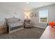 Neutral bedroom with a comfortable crib and window views at 8346 E 132Nd Dr, Thornton, CO 80602