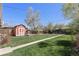 Spacious backyard featuring a shed and a well-maintained lawn at 3300 Oneida St, Denver, CO 80207