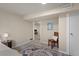 Inviting basement area with a patterned rug and a comfortable chair at 3300 Oneida St, Denver, CO 80207