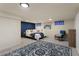 Spacious bedroom design with an inviting rug, modern furnishings, and a stylish accent wall at 3300 Oneida St, Denver, CO 80207