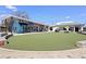 Charming exterior of Dang Soft Serve Ice Cream and a Torpedo bar with a green lawn and outdoor seating at 3300 Oneida St, Denver, CO 80207