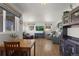 Bright and airy living room featuring hardwood floors, comfortable seating, and natural light at 3300 Oneida St, Denver, CO 80207