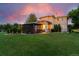 Expansive backyard showcasing a covered patio with outdoor seating and a gazebo with a view of the lawn at 7 Sandpiper Cir, Thornton, CO 80241
