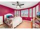 View of the bedroom featuring a large window and curved walls, a bed, and carpeted flooring at 7 Sandpiper Cir, Thornton, CO 80241
