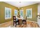 Cozy breakfast nook with wood floors, plantation shutters, and modern lighting at 7 Sandpiper Cir, Thornton, CO 80241