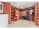 View of the walk-in closet featuring custom shelves, drawers, and plenty of hanging space at 7 Sandpiper Cir, Thornton, CO 80241