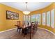 Formal dining room featuring a stylish light fixture and plantation shutters at 7 Sandpiper Cir, Thornton, CO 80241