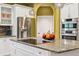 Updated kitchen features granite countertops and a stainless steel refrigerator at 7 Sandpiper Cir, Thornton, CO 80241