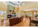 Open living room featuring a fireplace, high ceilings, and hardwood floors at 7 Sandpiper Cir, Thornton, CO 80241