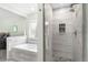 Bathroom features a tub and stone shower at 3257 Sun Ridge Ln, Evergreen, CO 80439