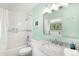 Bright bathroom with a shower-tub combo, marble vanity, and modern fixtures at 3257 Sun Ridge Ln, Evergreen, CO 80439