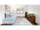 Bright bedroom with a daybed, hardwood floors and stylish decor offers a relaxing retreat at 3257 Sun Ridge Ln, Evergreen, CO 80439
