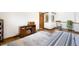 Inviting bedroom with hardwood floors, cozy daybed, wood trim, and stylish furniture at 3257 Sun Ridge Ln, Evergreen, CO 80439
