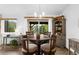 Formal dining room featuring a round table with mountain views and a hutch at 3257 Sun Ridge Ln, Evergreen, CO 80439