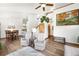 Open concept living and dining area with hardwood floors, high ceilings and recessed lighting at 3257 Sun Ridge Ln, Evergreen, CO 80439
