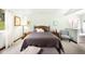 Spacious primary bedroom featuring natural light, soft carpet, and ensuite bathroom access at 3257 Sun Ridge Ln, Evergreen, CO 80439